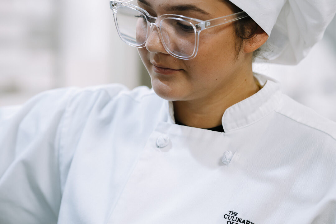 Culinary students at work in a commercial kitchen at CSFTW