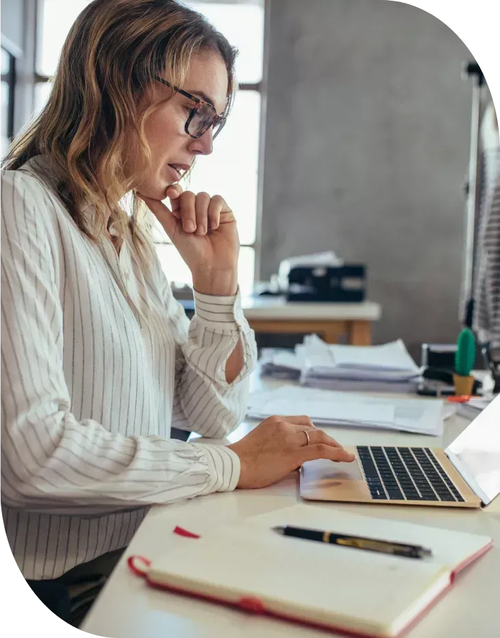 service business owner working on marketing at her desk