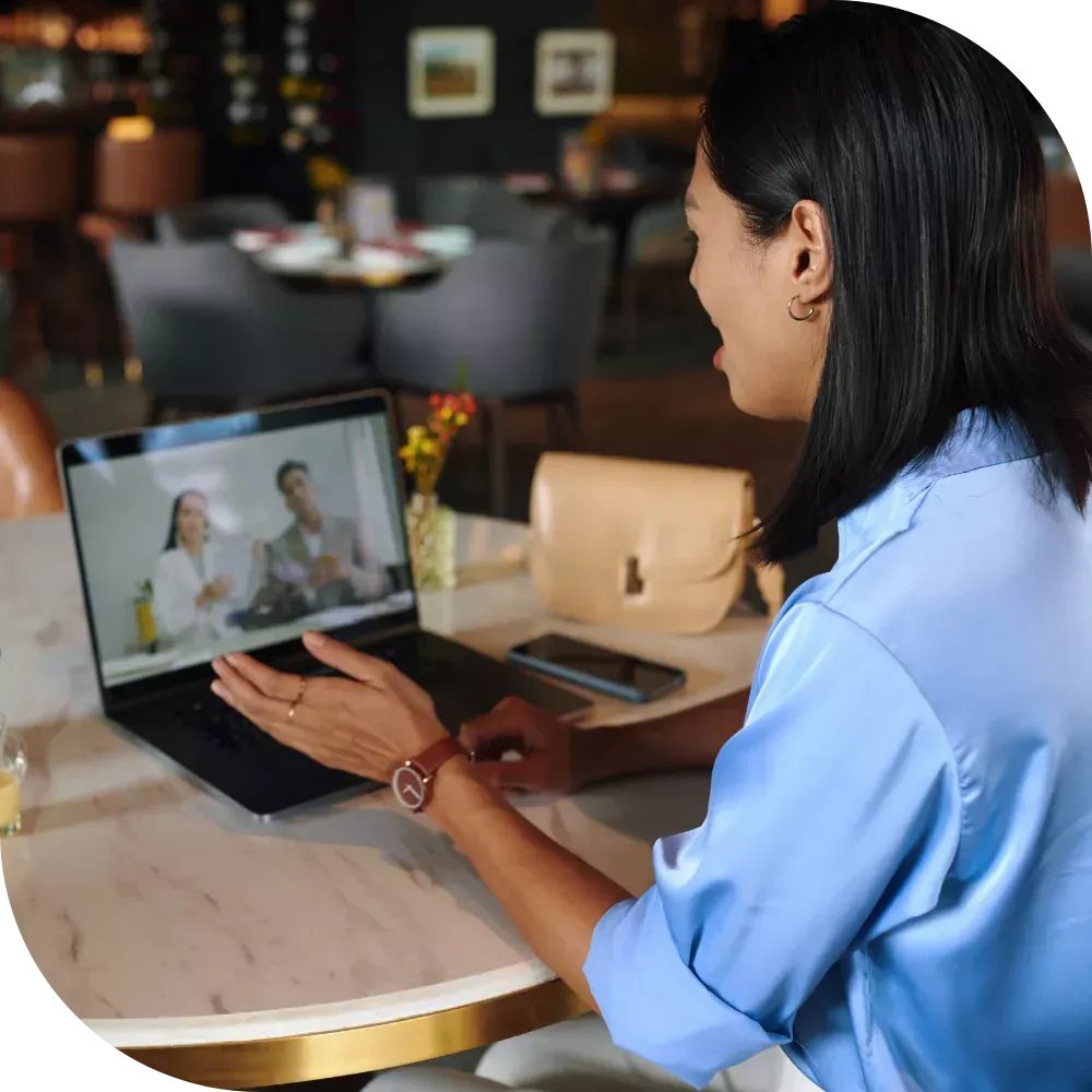 small business owner managing marketing tasks on laptop