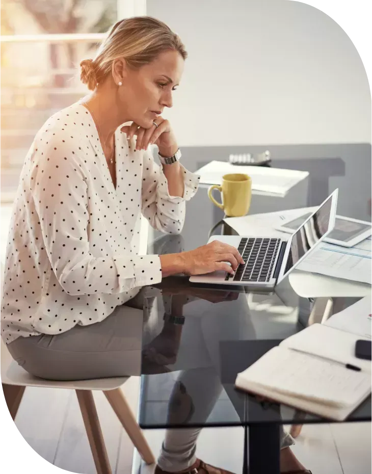 service business owner working on marketing at her desk
