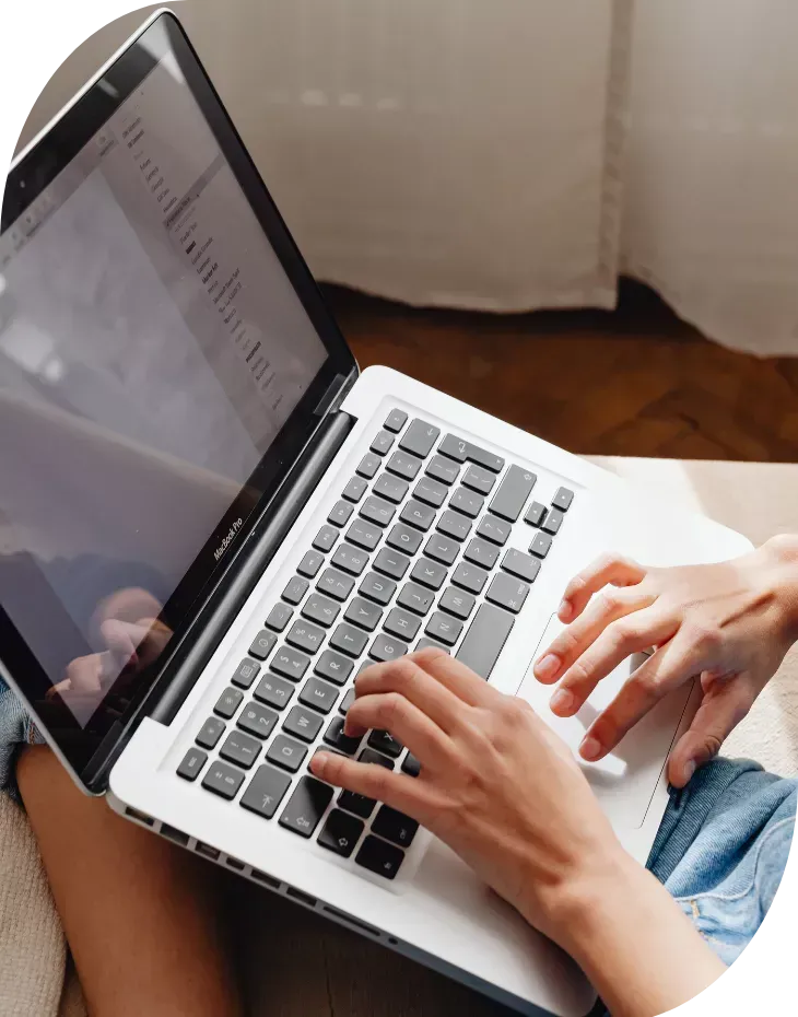 small business owner managing marketing tasks on laptop