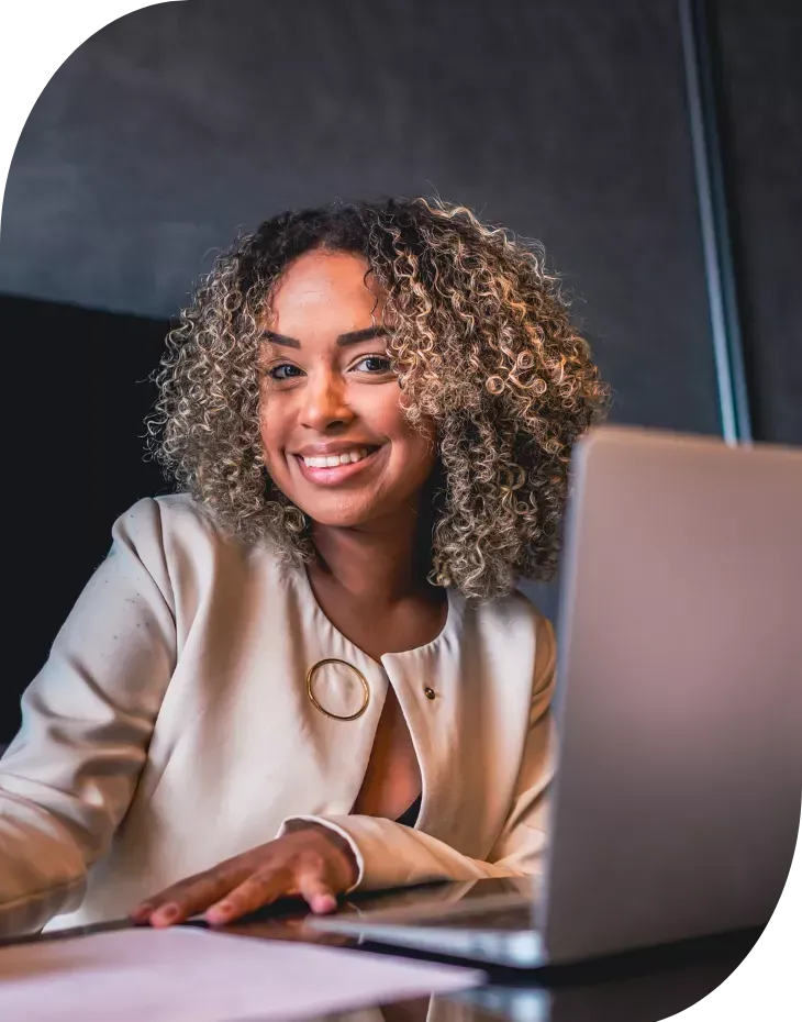 small business owner managing marketing tasks on laptop