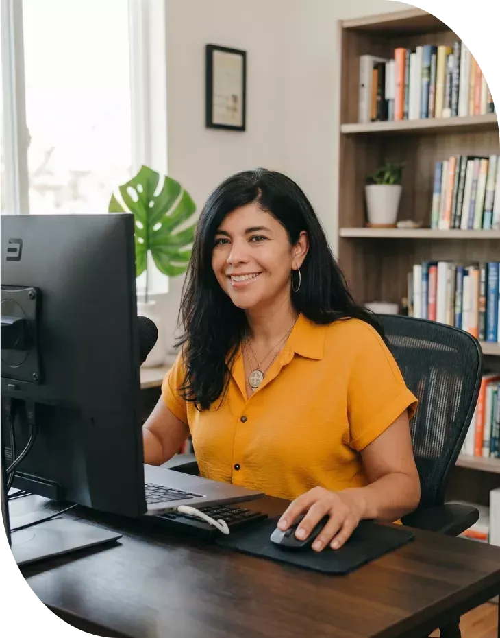 small business owner managing marketing tasks on laptop