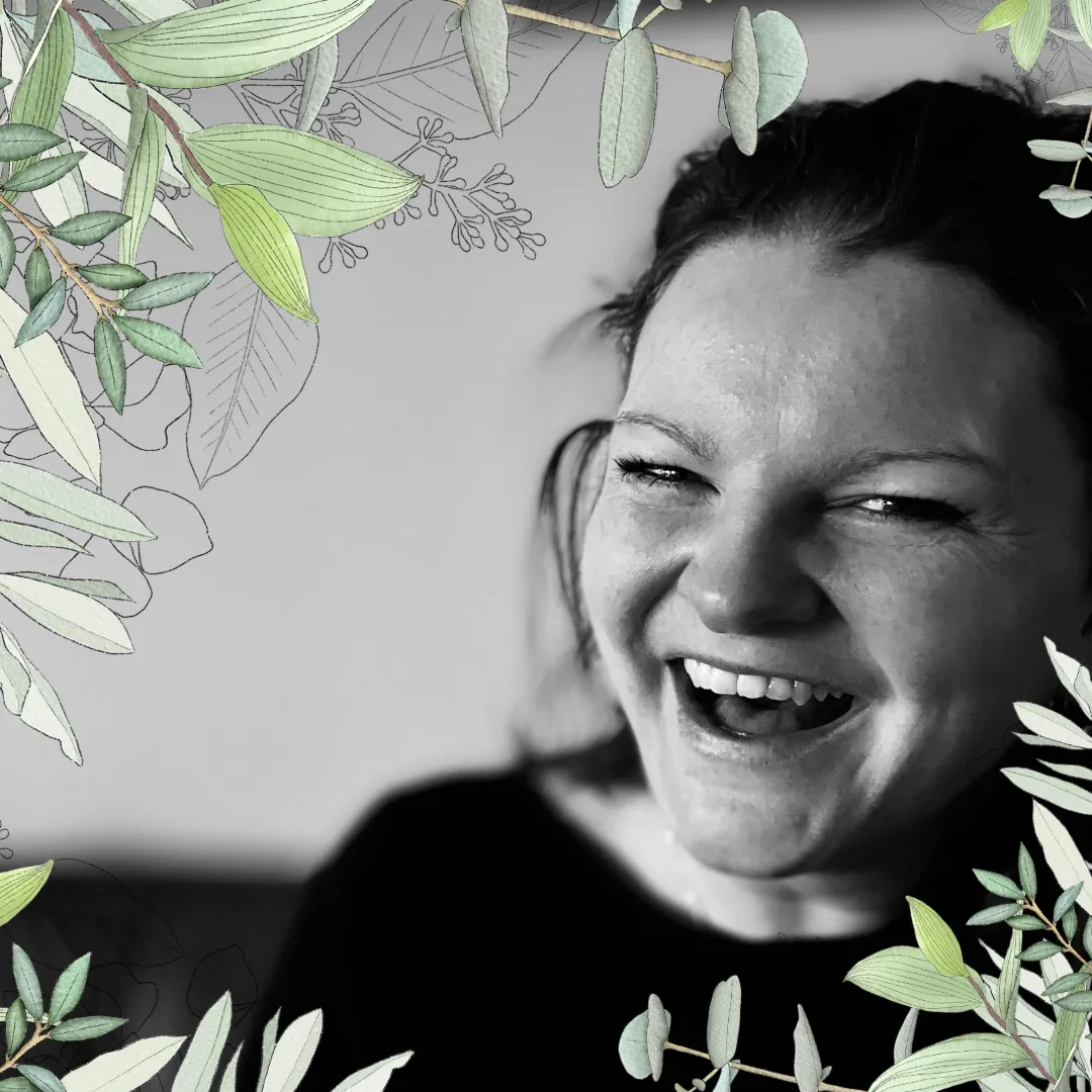 Melanie Elizabeth, smiling and laughing. 