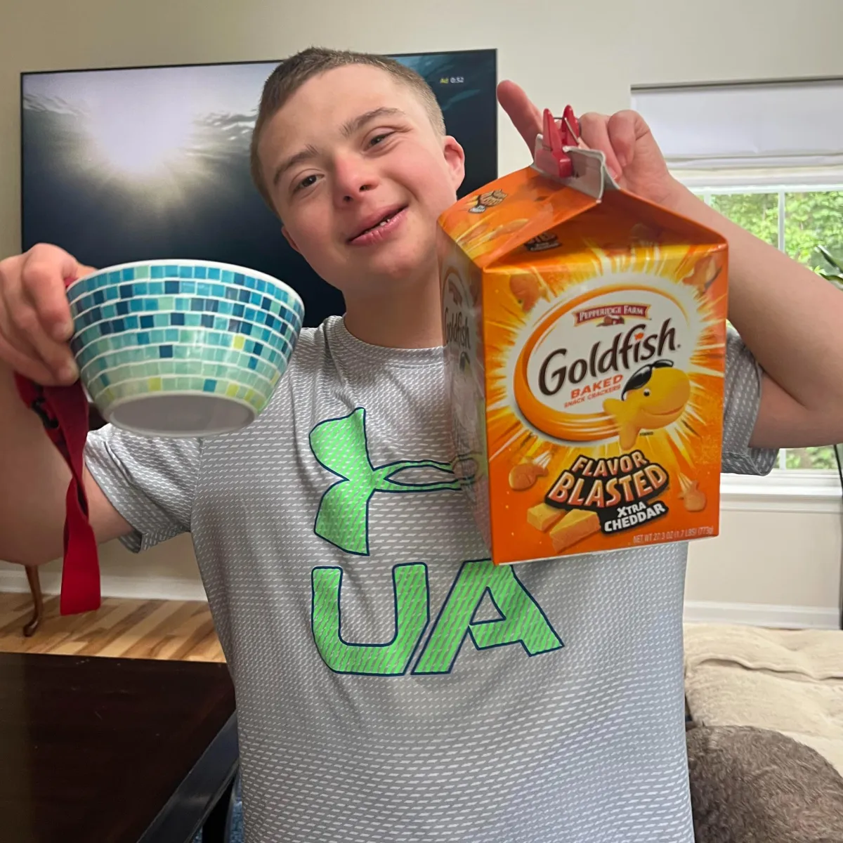 Boy holding box of goldish