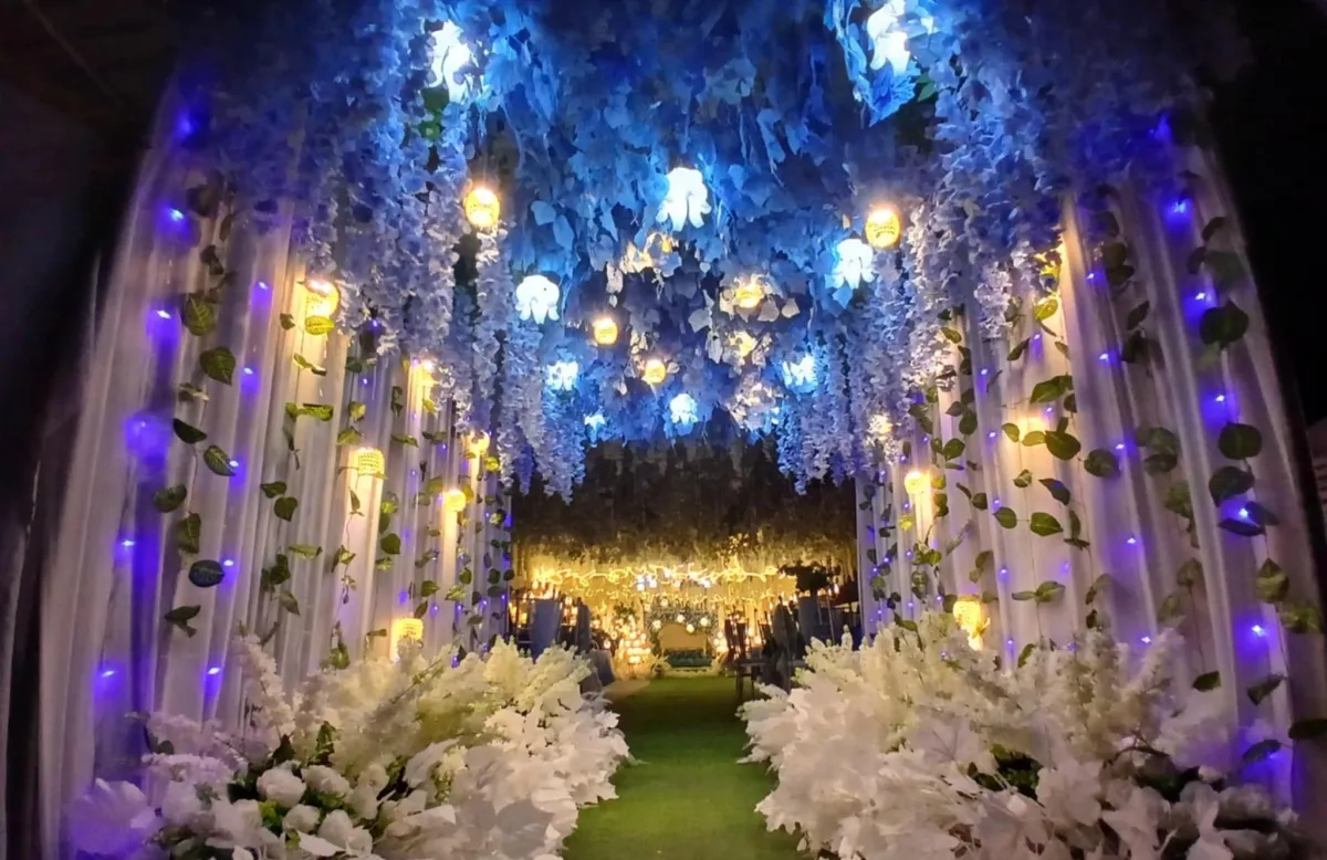 man holding incandescent bulb