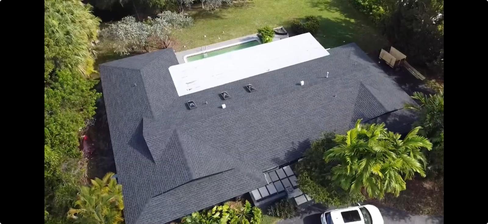 the roof of a building with snow on it