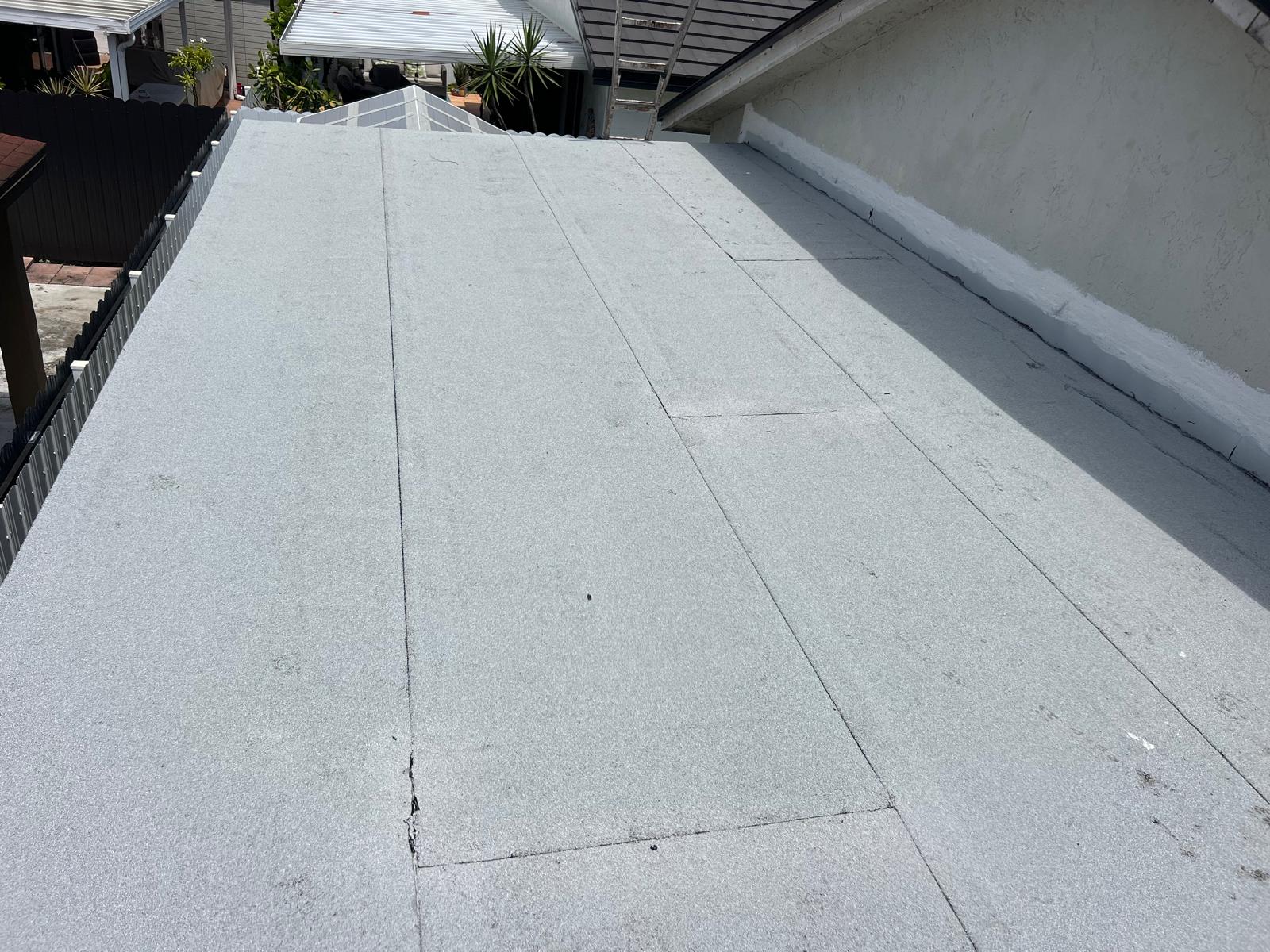 the roof of a building with snow on it