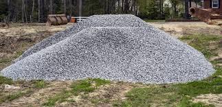 Mound of gray crushed gravel ready for delivery by WB Group