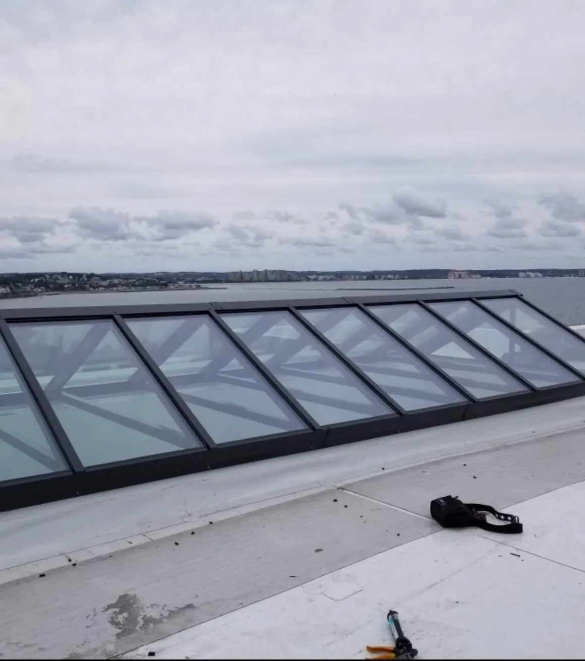 a circular window with a cloudy sky