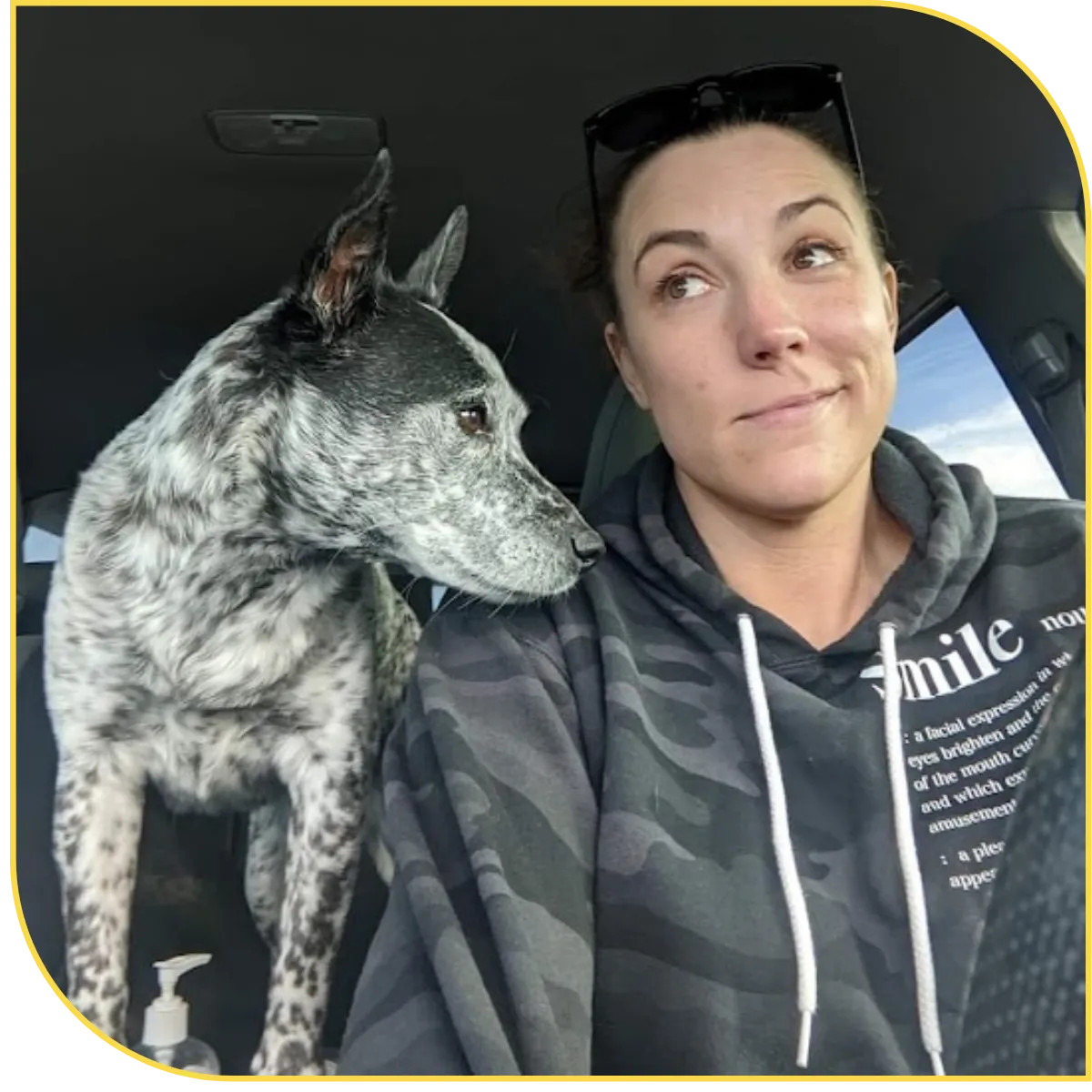 Brittany silva in a car with her dog