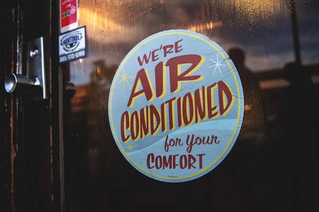 Window sign saying we are air conditioned for your comfort