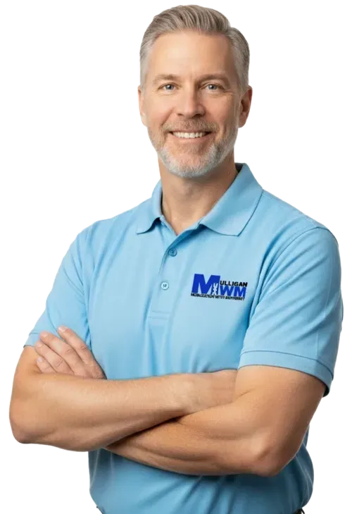 Confident Mulligan with Movement USA Mulligan Concept instructor standing with arms crossed.