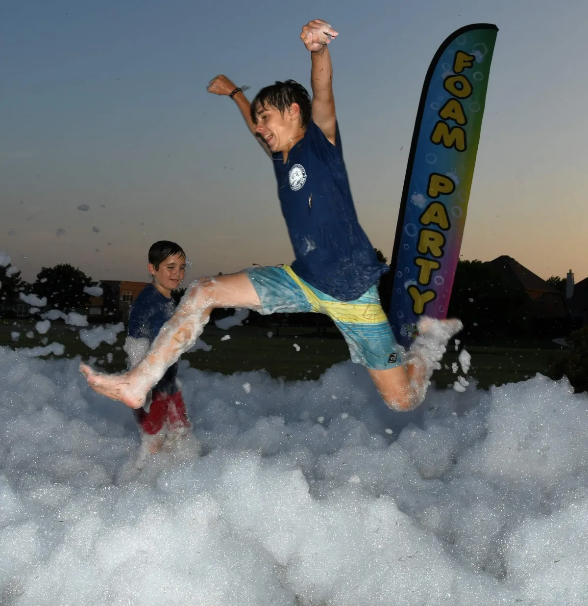 Foam Party pic kid jumping and having fun
