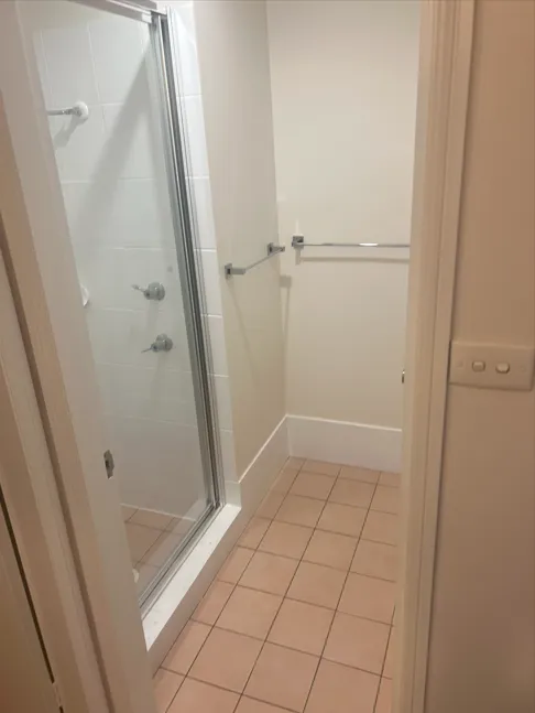 a bathroom with two sinks and a large mirror