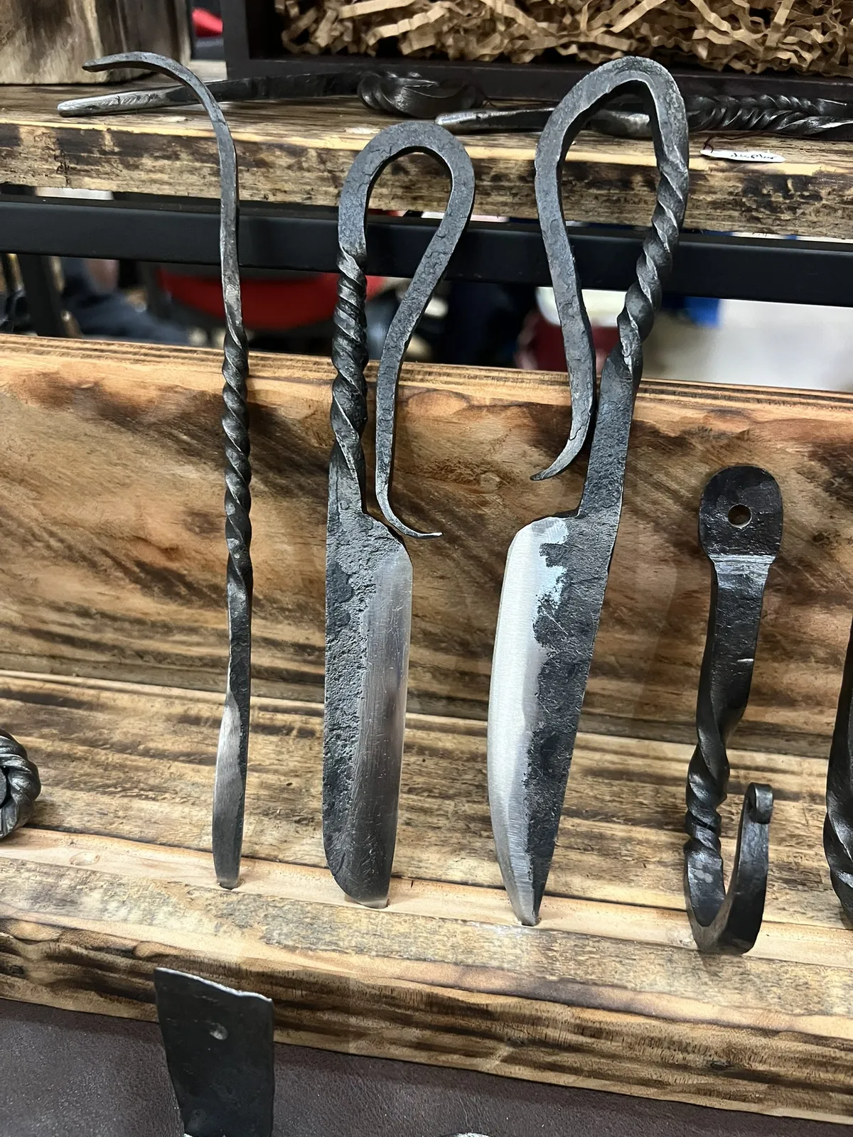 A pair of blacksmith style knives with standard and wharcliff blades
