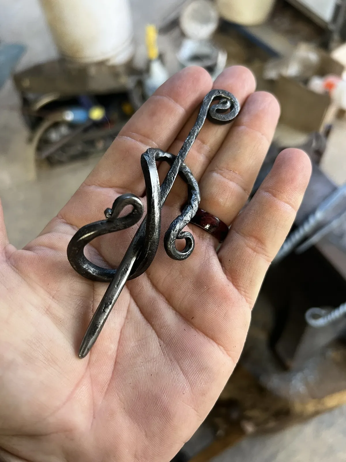 A forged iron hair clip with iron stick