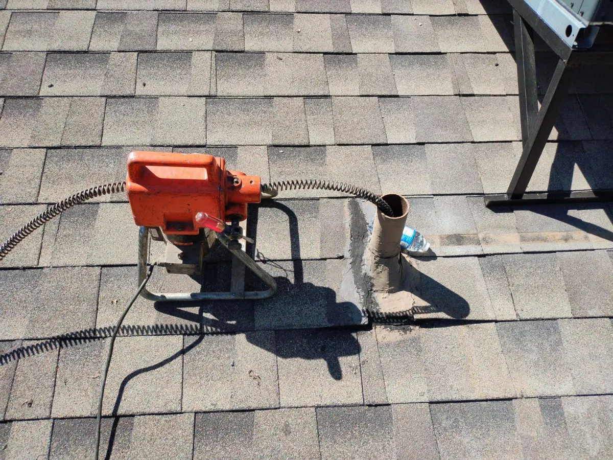 Repairing bathroom drain through the roof. 