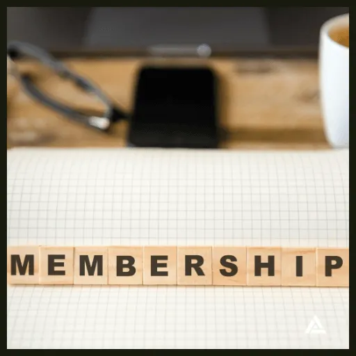 Image of membership wood blocks and coffee and note pad setting.