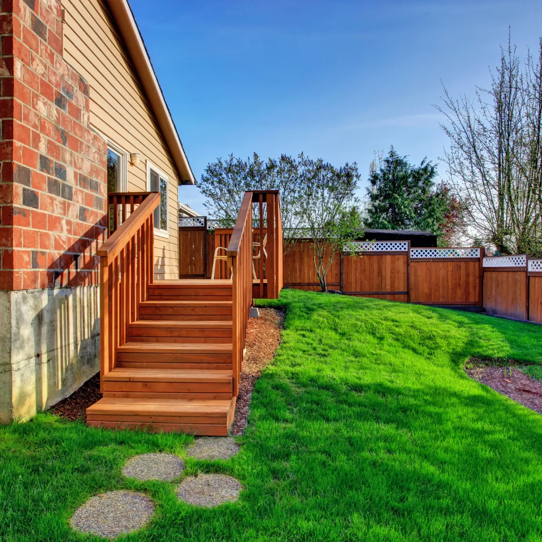 Integrated deck and fence design services for cohesive outdoor living spaces