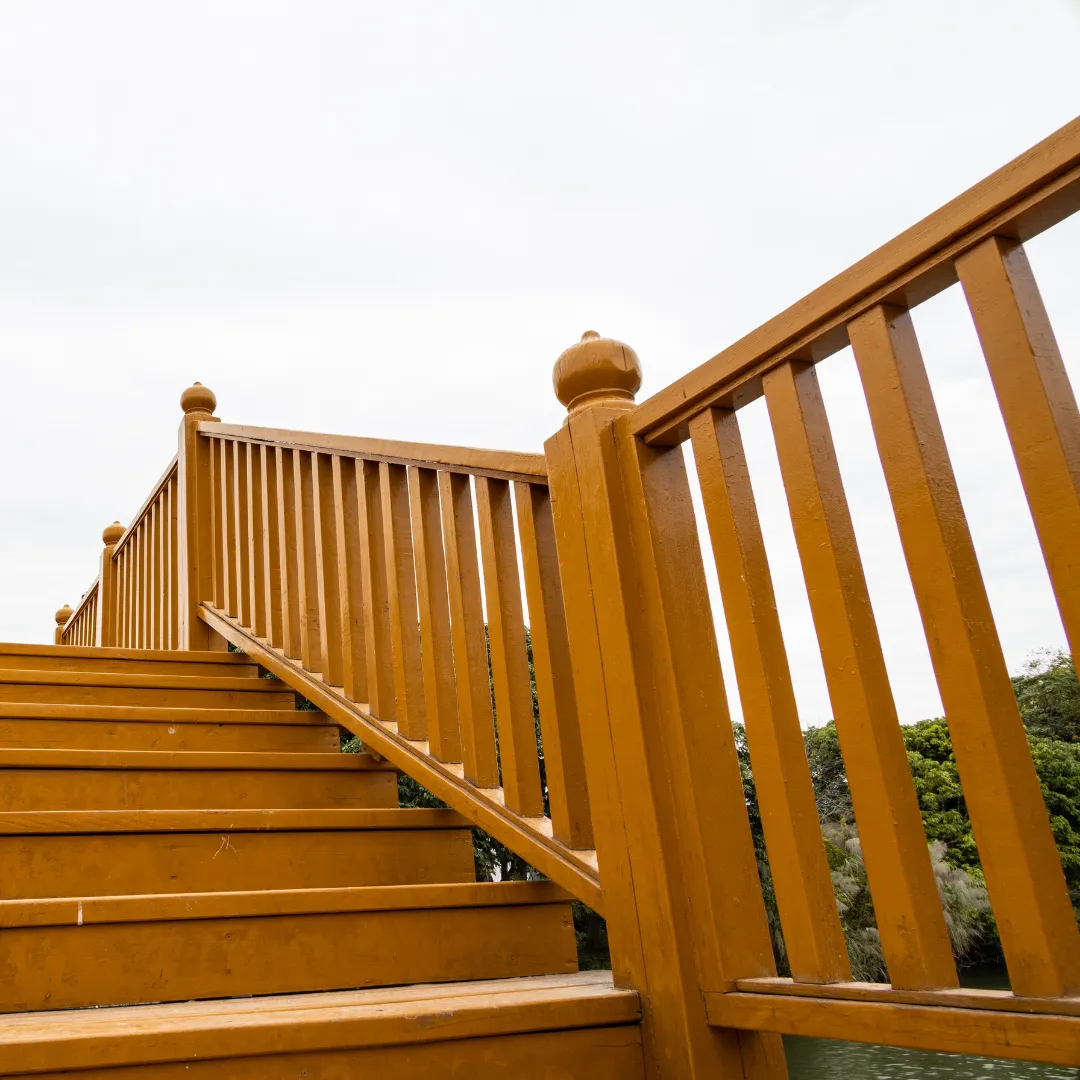 Custom stairs and railings for deck and fence combination construction