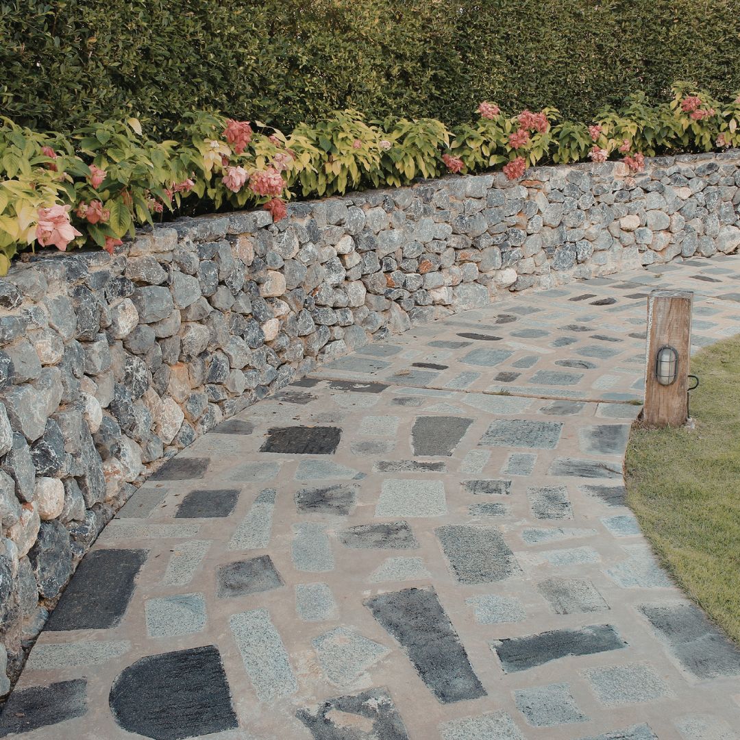 Custom backyard hardscape with concrete patios and walkways for outdoor living