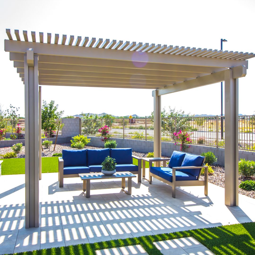 Freestanding pergola providing shade and outdoor living space in a backyard