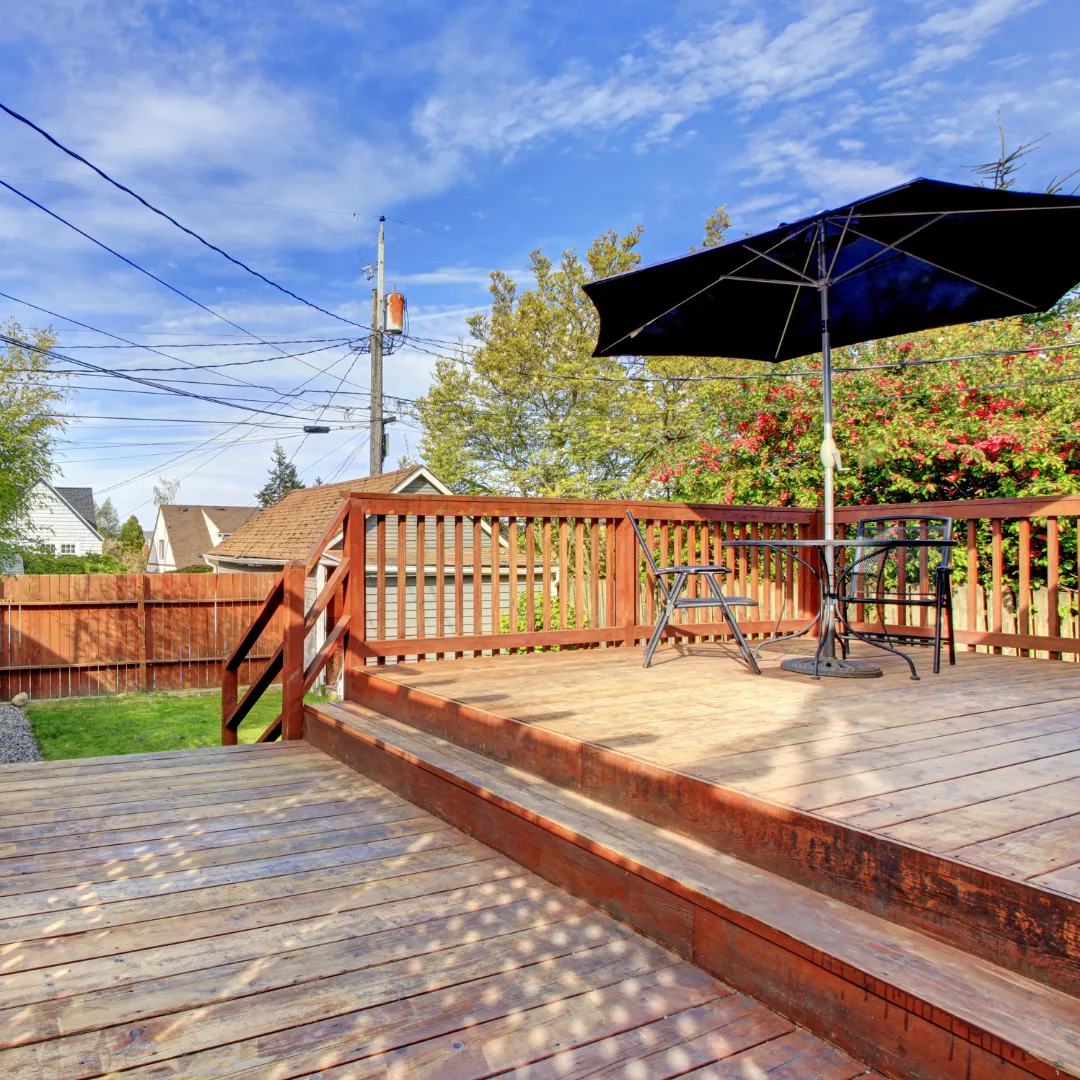 Backyard deck and fence combination designed for privacy and outdoor living