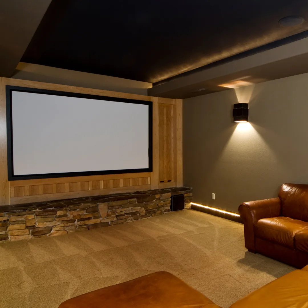 Home theater and entertainment room created through basement finishing