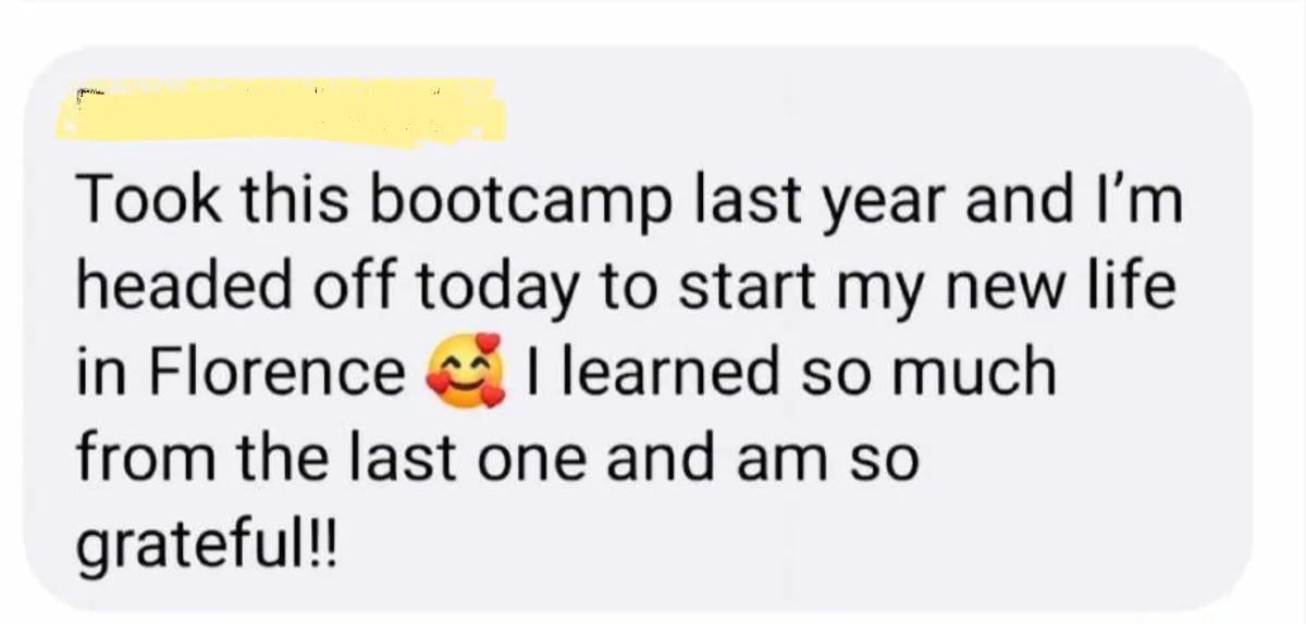 Bootcamp member selfie toast with wine glass overlooking a Mediterranean sunset