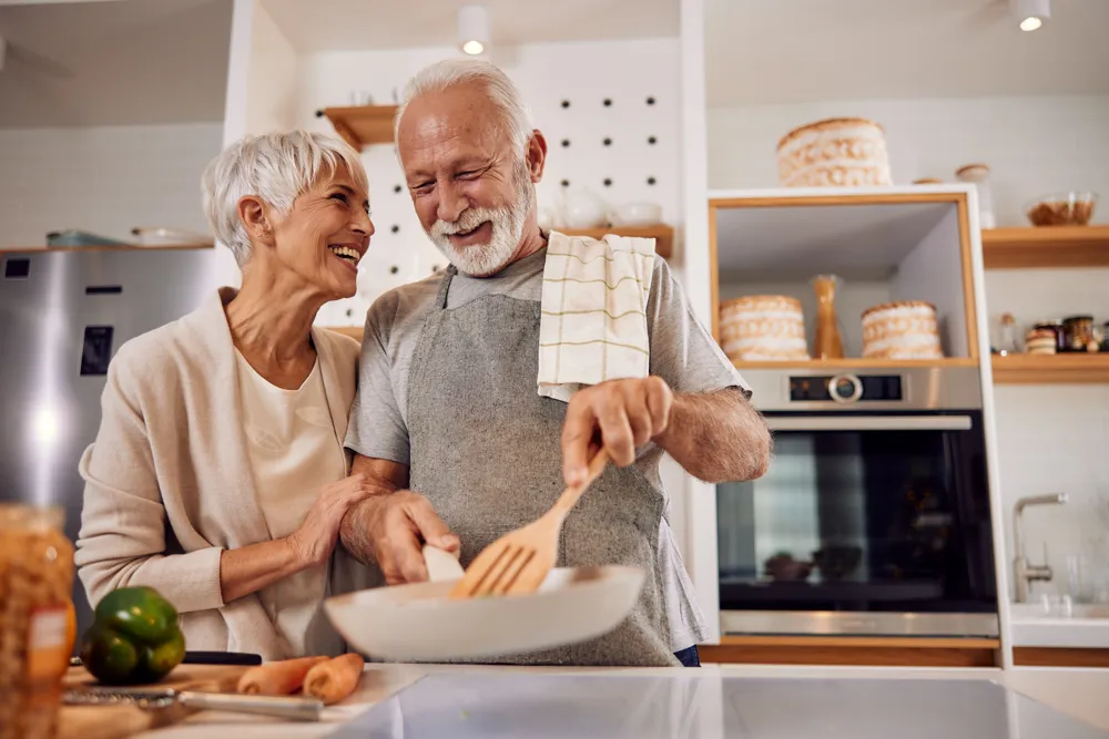 Older couple cooking together
