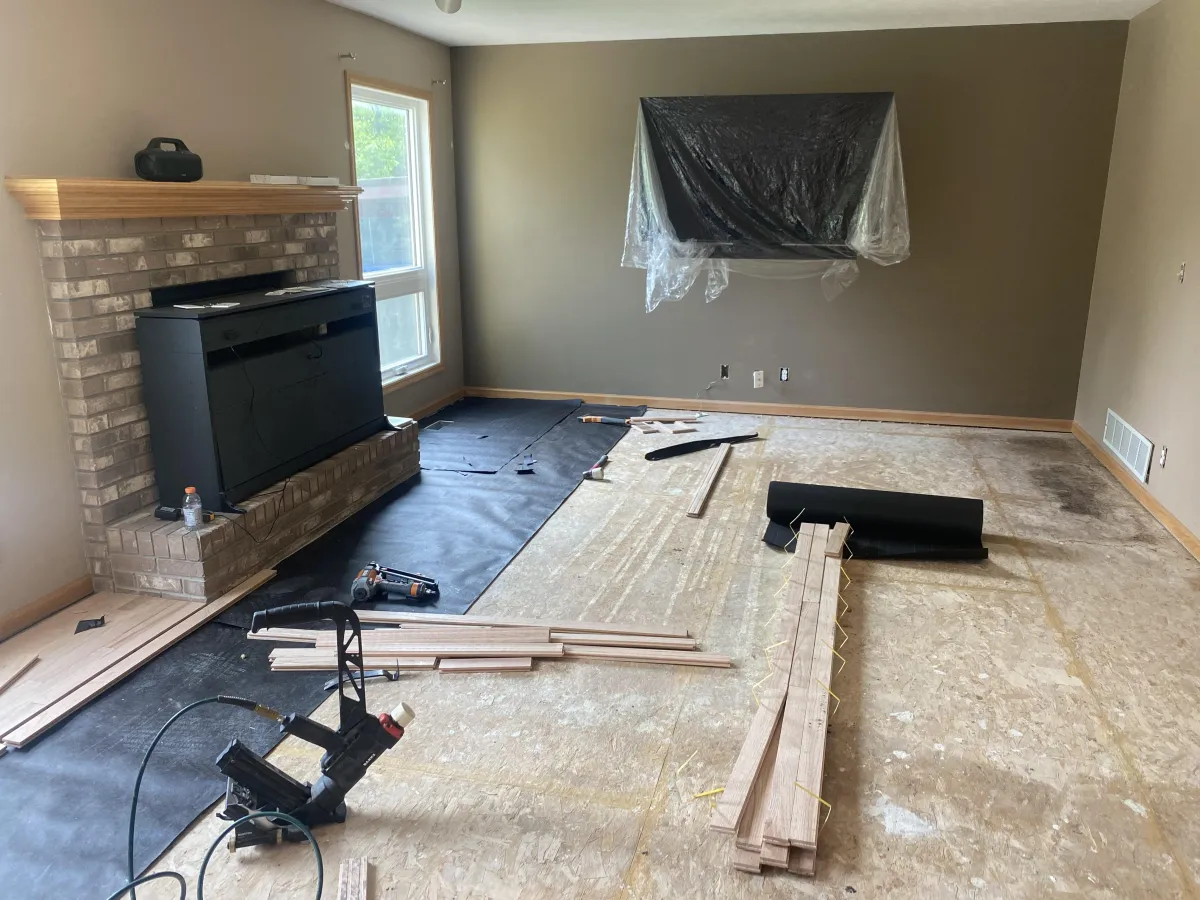 A room with a purple carpet and a chandelier
