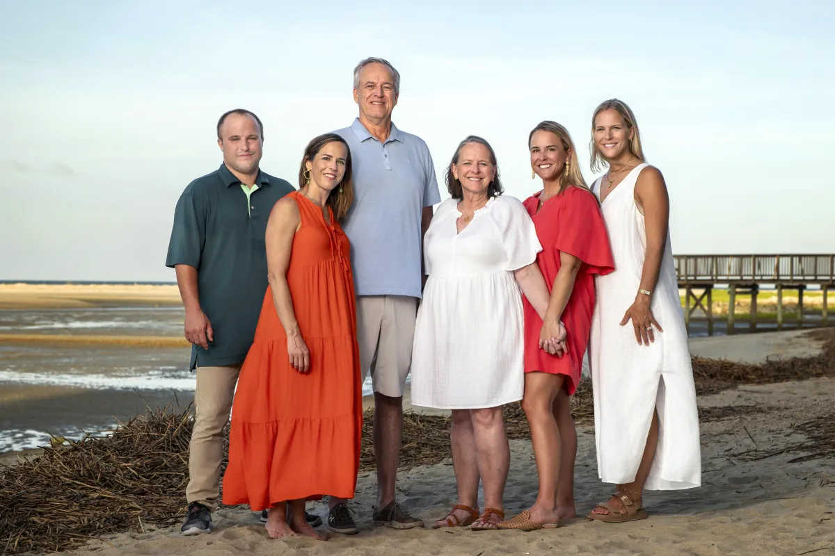 Family standing together on Hilton Head beach during a Quick Take photography session