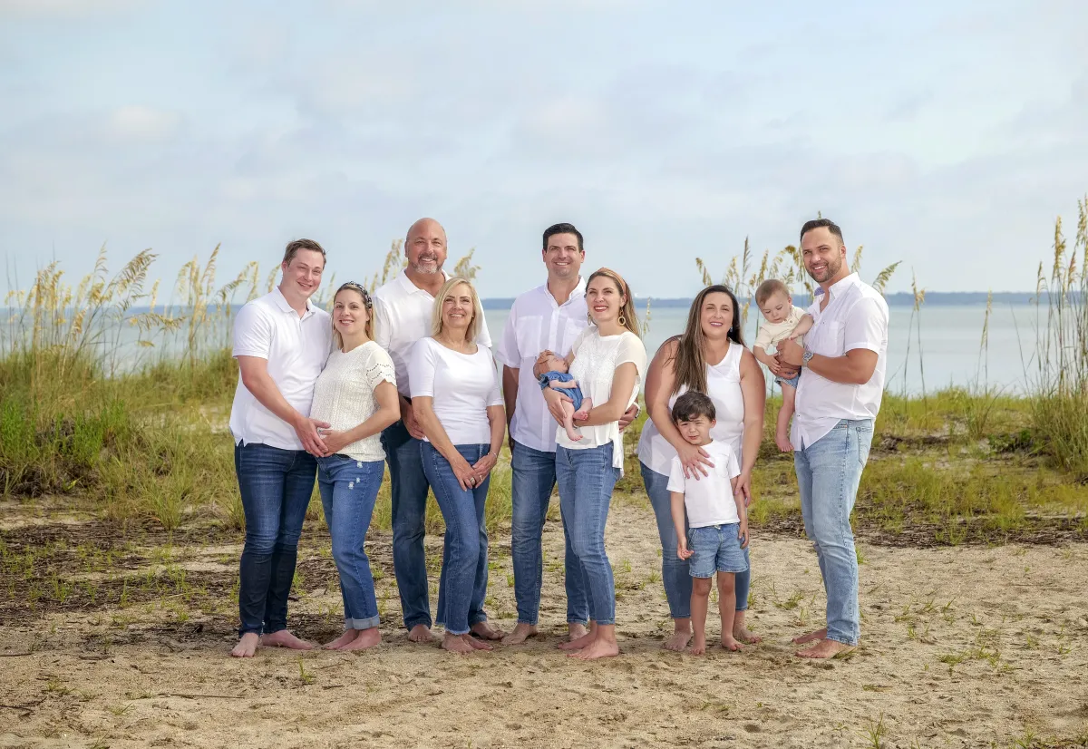 Large extended family posing on Hilton Head beach during Signature beach photography session
