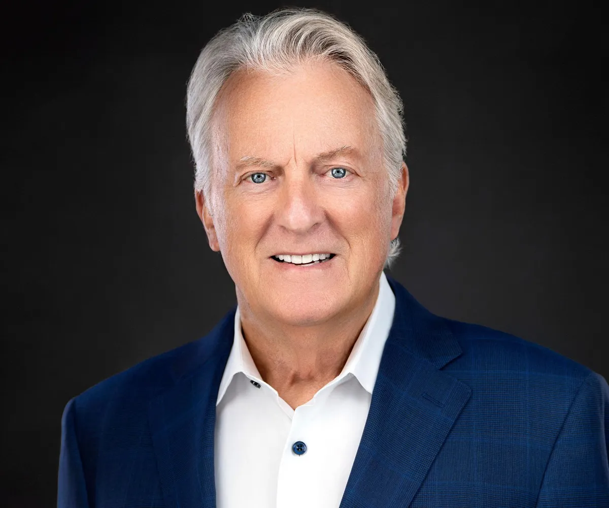 Chamber member headshot on light gray — consistent look for team profiles.