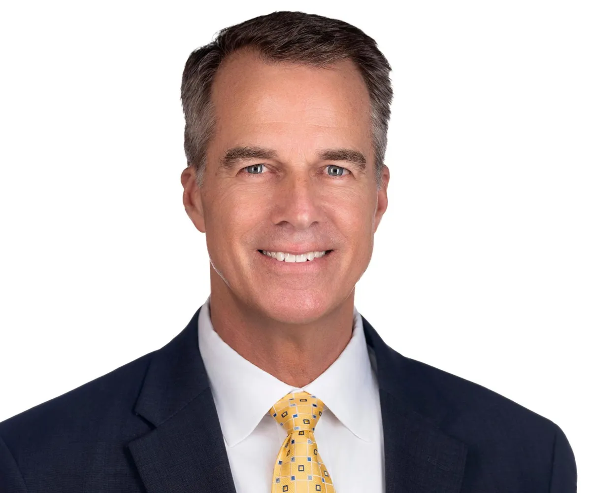 Clean executive headshot on white background for LinkedIn and website profiles.