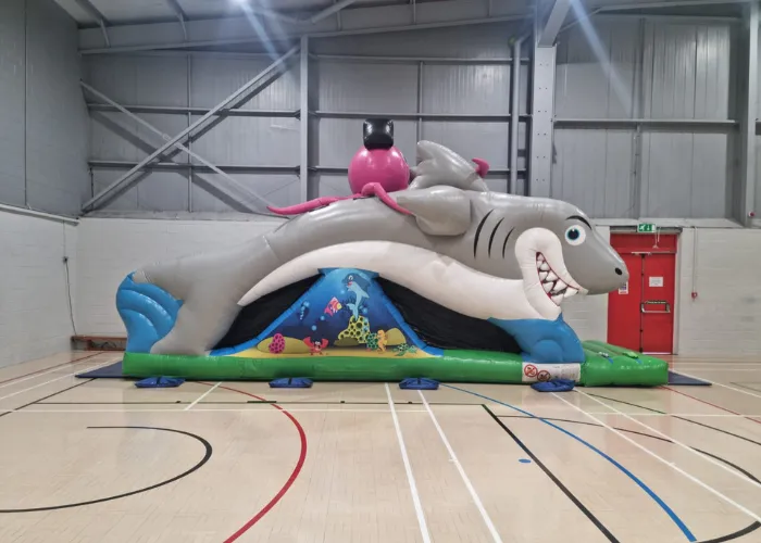 Inflatable shark obstacle course in a sports hall