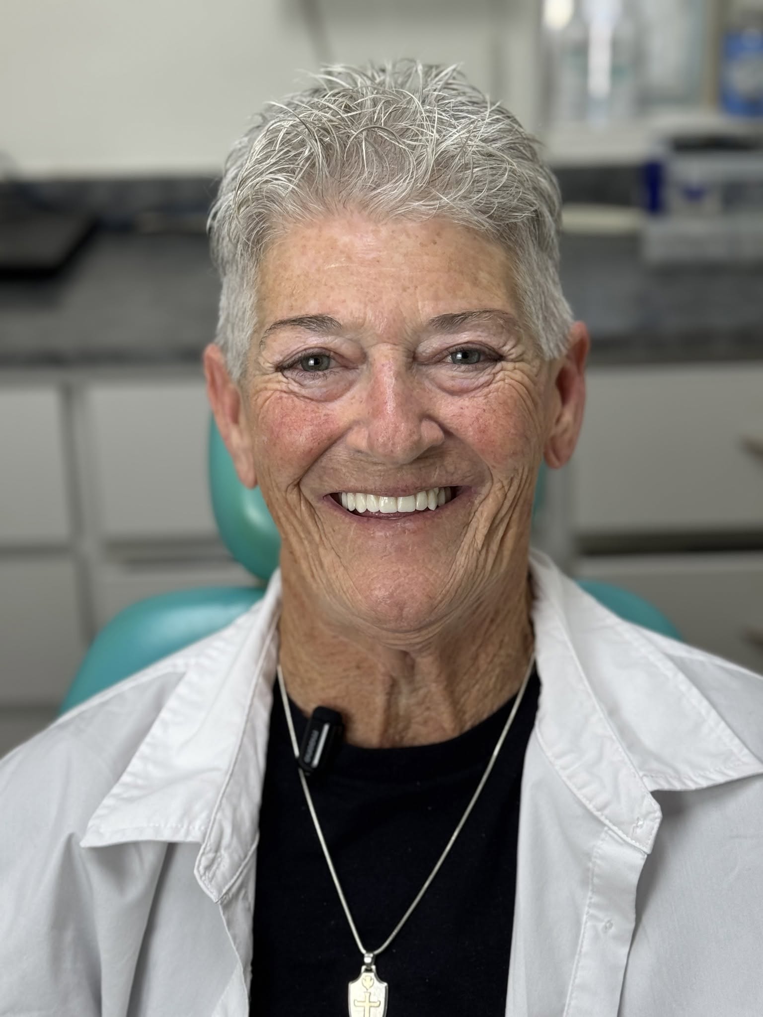 Before and after dental implant restoration split view for patient Linda W