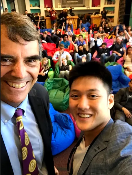 Alaric Ong with Tim Draper