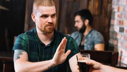 silhouette of woman raising her right hand