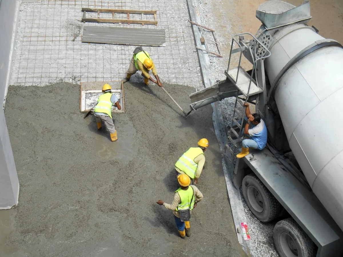 workers pouring a concrete driveway in Oceanside, CA