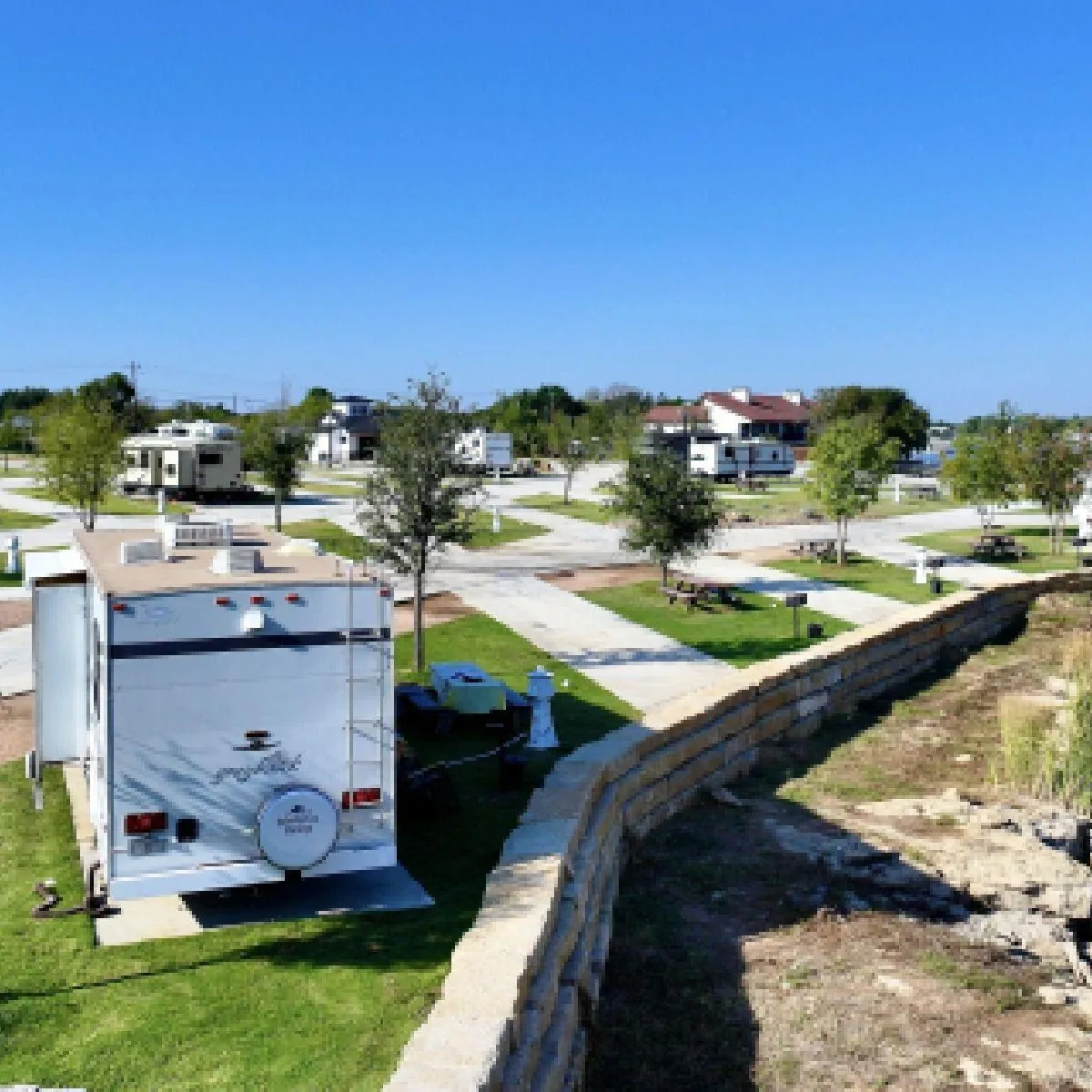 Guests walking from their RV to the shore of Possum Kingdom Lake for swimming and fishing