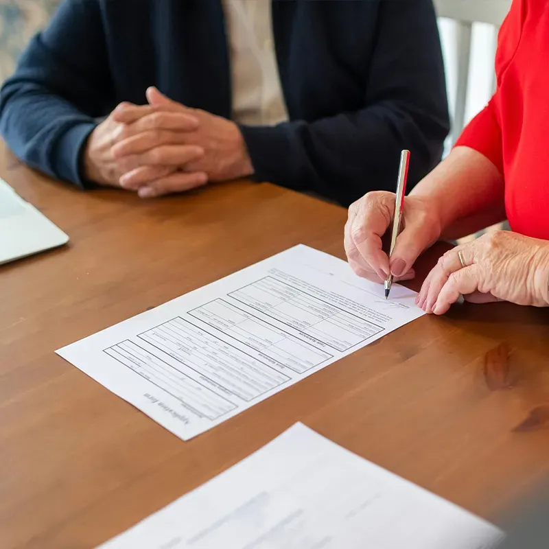 mature couple examining paper work related to medicare
