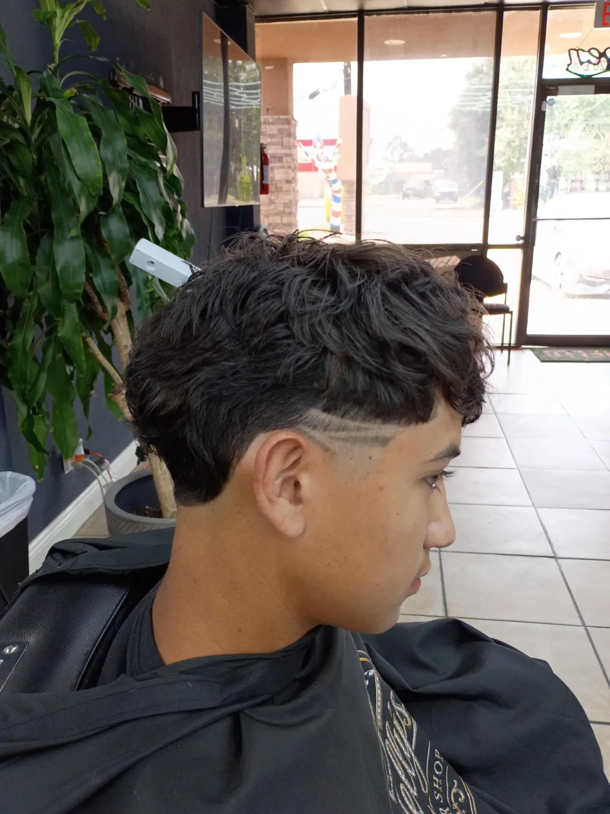 JD Nelly's master barbers at work in their Houston shop