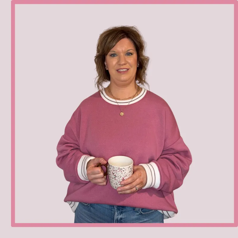 Christian mom entrepreneur holding a coffee mug, sharing her routin-based approach to balancing home, faith, and business.