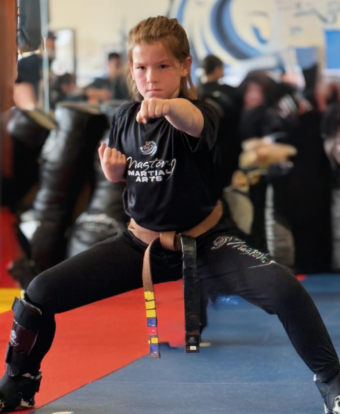 child practicing martial arts stance building confidence and discipline in kids training class