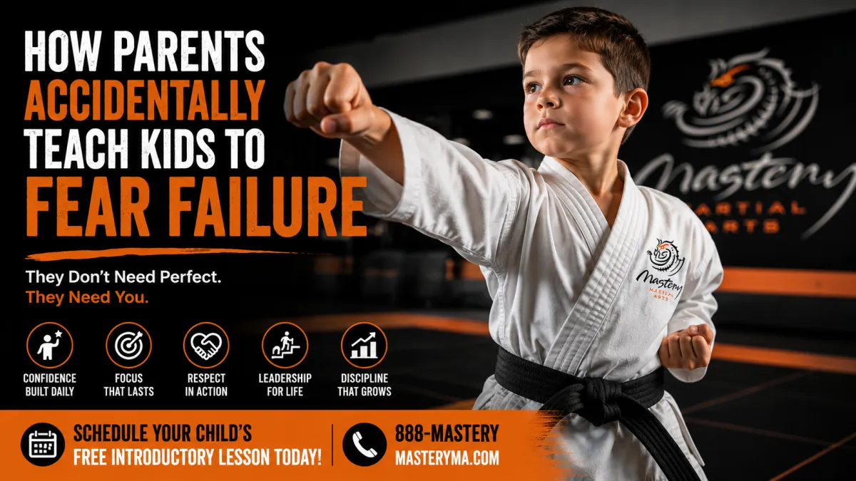 A confident young child in a Mastery Martial Arts uniform learning through encouragement and challenge while building resilience instead of fearing failure.