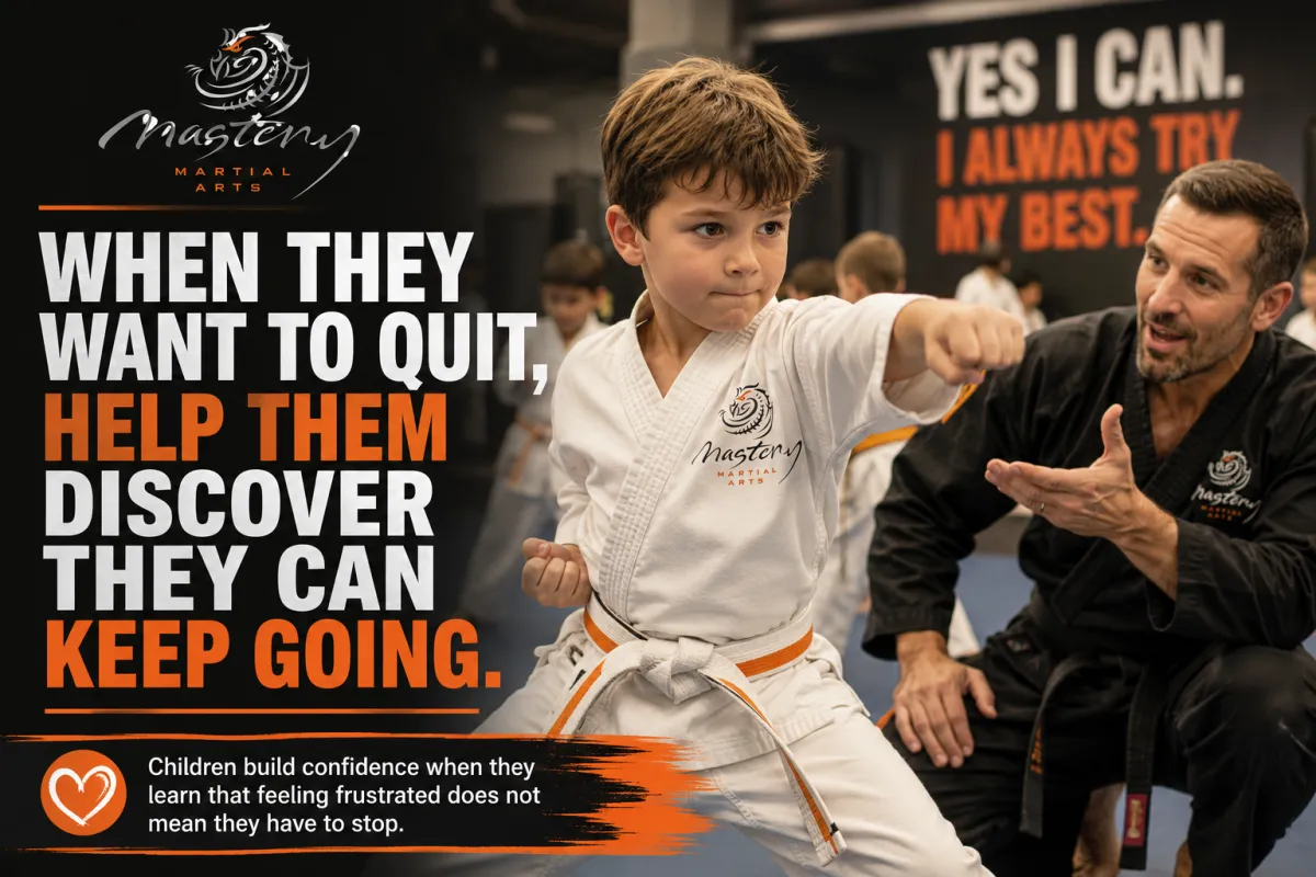 A determined child continuing to practice during a Mastery Martial Arts class while an encouraging instructor helps build perseverance and confidence.