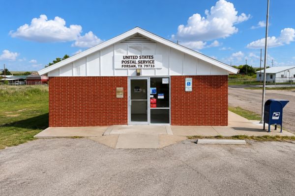 Exterior of the United States Post Office in Forsan, Texas, featuring the main entrance and USPS mailbox.