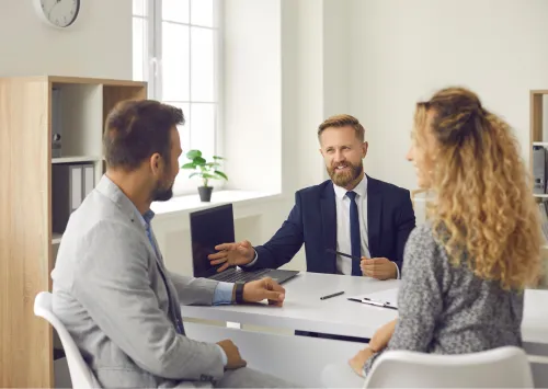 an easy close home buyers agent presenting an offer to two home owners 